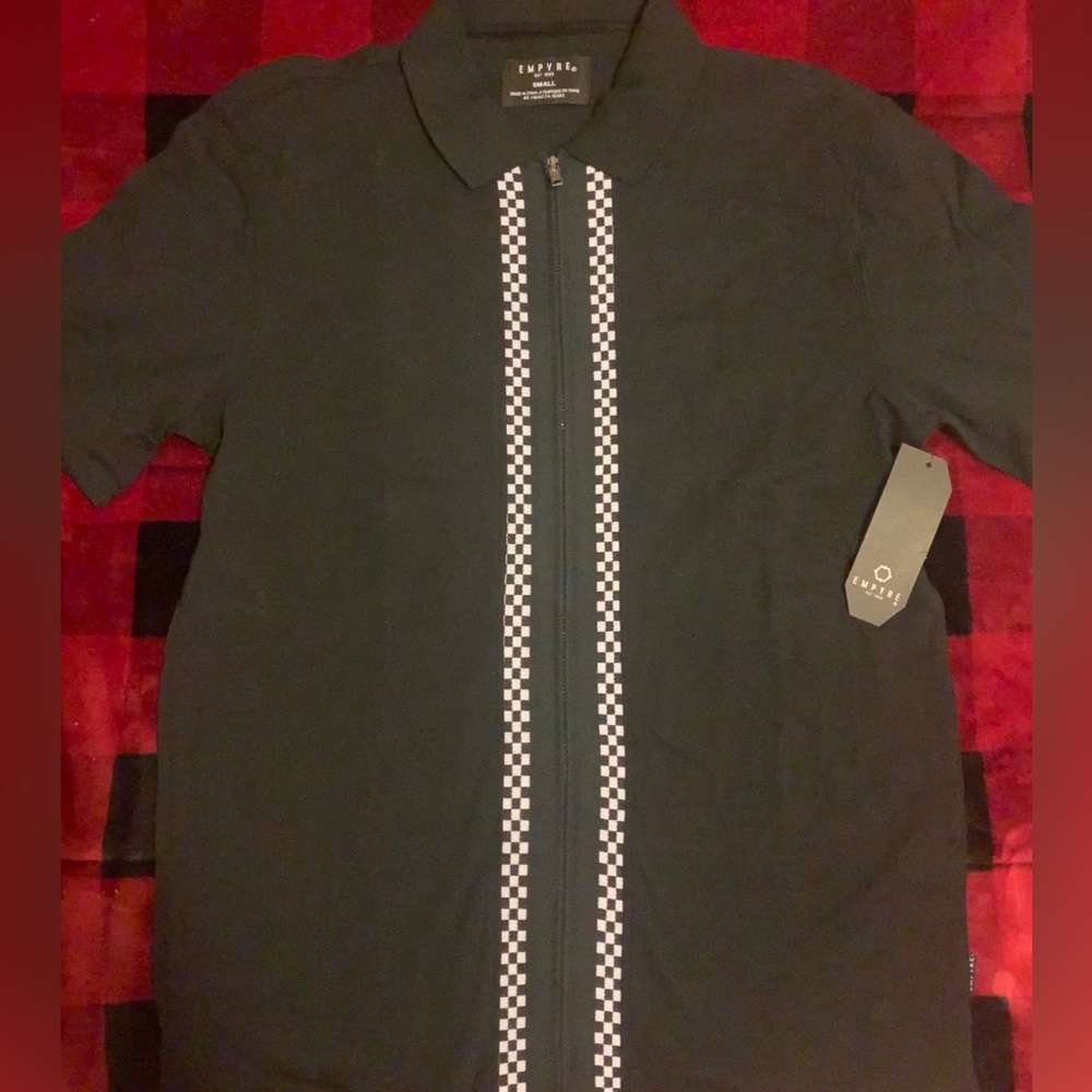 Black polo. New with tags. Men’s small